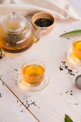 Tea concept. Glass cup of tea on wooden background