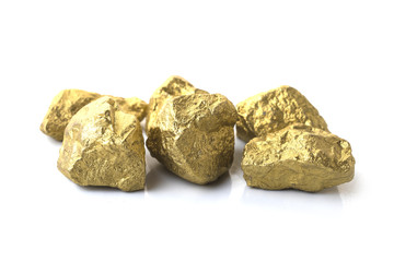 mound of gold close-up on white background