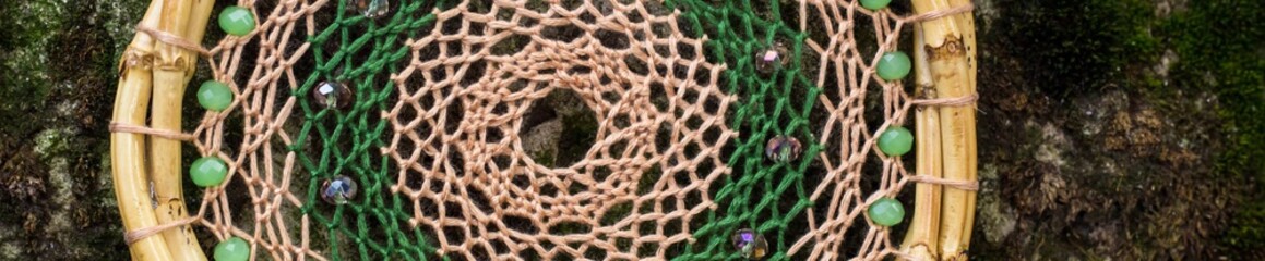 Banner of Handmade dream catcher with feathers threads and beads rope hanging