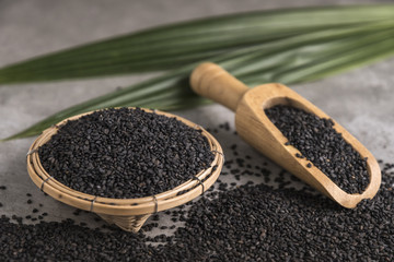 Black Sesame on wooden spoon.