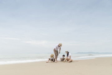 happy family with two kids on the beach,