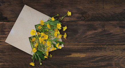 yellow Little field flowers in Envelope Rustic Wooden Background Banner Flat Lay