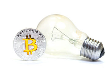 Silver bitcoin and bulb isolated on white backround