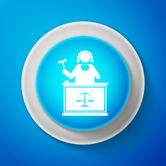 White Judge with gavel on table icon isolated on blue background. Circle blue button with white line. Vector Illustration