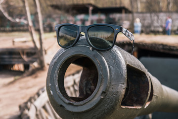 sunglasses on the artillery gun spring day