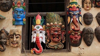 Wooden masks representing hindu gods. Scene in Kathmandu, Nepal.