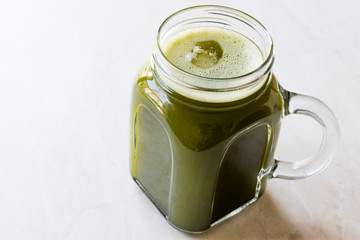 Cold Iced Matcha Tea in Mason Jar with ice.