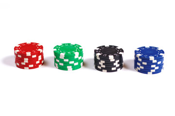 Four stacks of poker chips isolated on white background