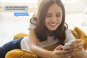A beautiful woman is accepting an invitation to a party, via text messaging or chat through her...