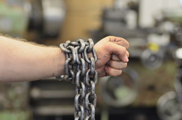 Hand with chain,the chain wound on the hand,dirty hand