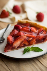 strawberry tart on wooden background.