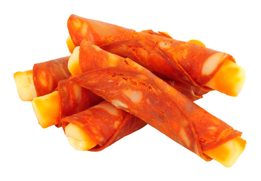 Gouda cheese wrapped in spicy Chorizo rollitos isolated on a white background