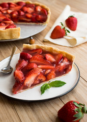 strawberry tart on wooden background.