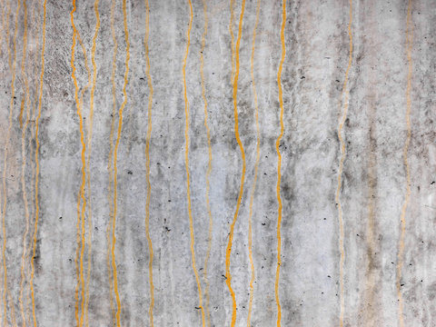 Raw gray concrete texture with rust stripes, customizable, suitable for background use.
