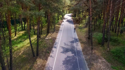Aerial top view of park forest road with bike lanes from above, Truhaniv island, Kiev, Ukraine
