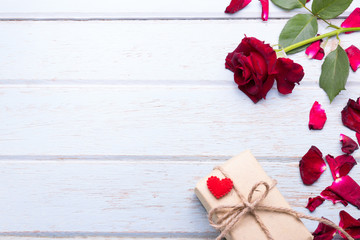 Red roses on wooden board background with copy space