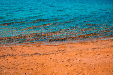 orange beach with clean blue water