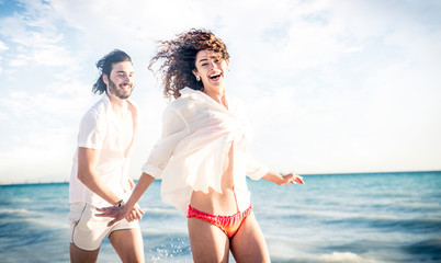 Young couple sharing happy  and love mood on the beach