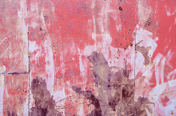 metal partially rusty sheet covered with different colors: pink, white, burgundy