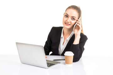 Smiling businesswoman using a laptop computer isolated on white background