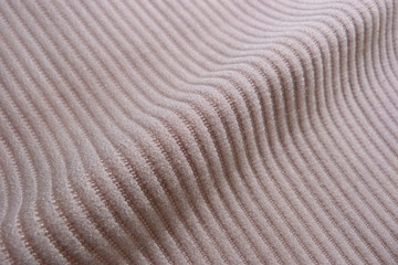 fabric close-up background for design beige color backdrop pile strips line grooves on fabric stripes on sand light background gray light brown golden sand soft fabric velvet vintage upholstery tapest