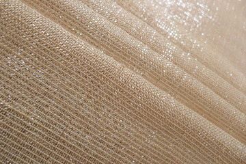 gold fabric brocade organza silk beige brown lurex fabric structure closeup background backdrop...