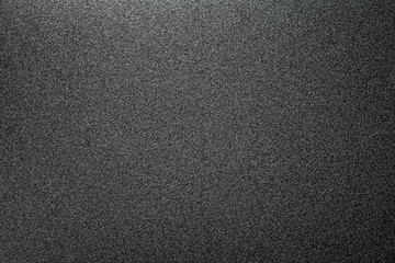 homogeneous matt texture of the tin surface, dark grey background