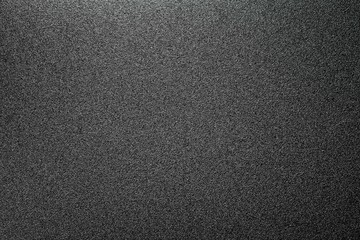 homogeneous matt texture of the tin surface, dark grey background