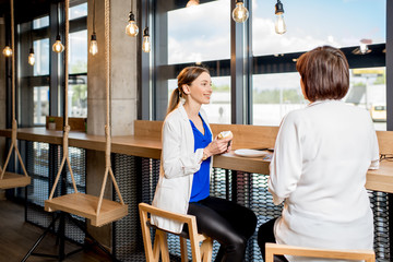 Business women sitting in the cafe