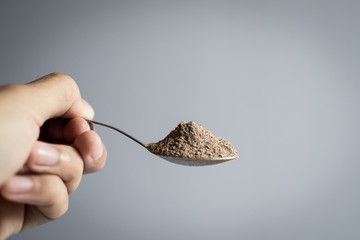 A spoon dip coffee powder.