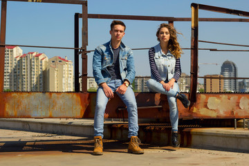 Fototapeta na wymiar Young beautiful fashion couple wearing jeans clothes in daylight. Love concept.