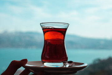 turkish breakfast with cup of tea in front of Bosphorus 