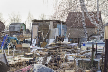 littered section of a country house, a mess in the suburban area
