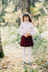 happy beautiful brunette girl with Caucasian appearance autumn in the Park