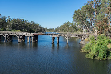 Fototapeta na wymiar Historic Chinamans Bridge over the Goulburn River near Nagambie in Australia.