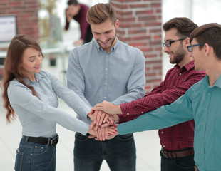 Group of people hands together partnership teamwork.