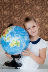 the child is studying the planet