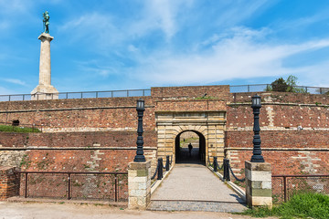 Naklejka premium Belgrade, Serbia April 24, 2018: Kalemegdan fortress with monument Victory and small gateway from the upper city