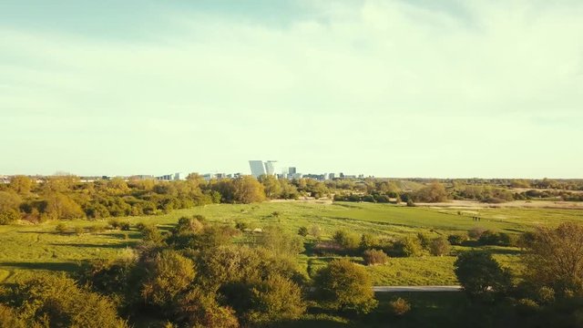 Copenhagen Skyline Drone ascension over Amager F&aelig;lled Bella sky