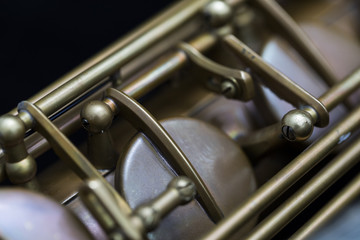 Fototapeta premium Vintage saxophone on a black background