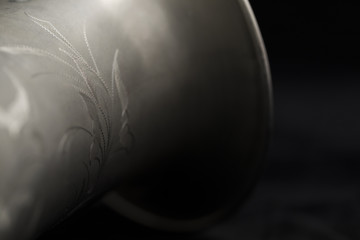 Vintage saxophone on a black background