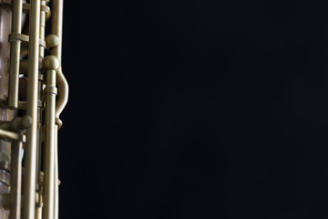 Vintage saxophone on a black background