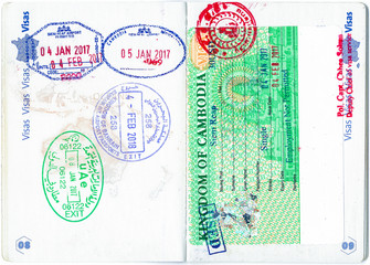 Stamps of Bahrain, UAE, Cambodia and a Cambodian visa in a French passport