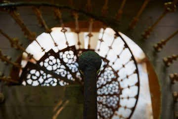 Beautiful spiral staircase with old rusty handrail