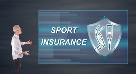 A sport insurance concept explained by a businessman on a wall screen