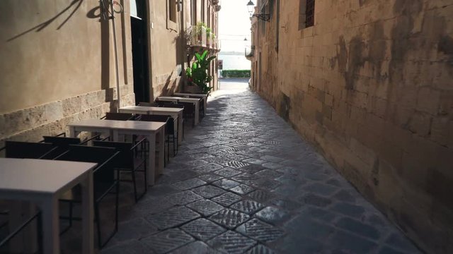 Typical old street restaurant overlooking the sea,  Italy, Sicily  Ortigia Island, Syracuse