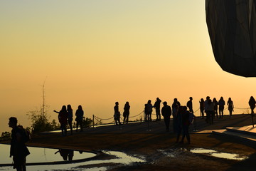 Silhouettes of people at sunset