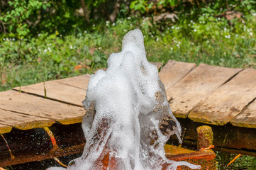 Sparkling, foamy mineral water breaks through the ground in Romania.
