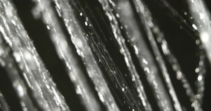 Thin trickle of water macro footage