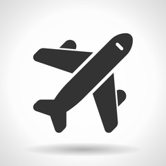 Monochromatic plane icon with hovering effect shadow on grey gradient background. EPS 10
